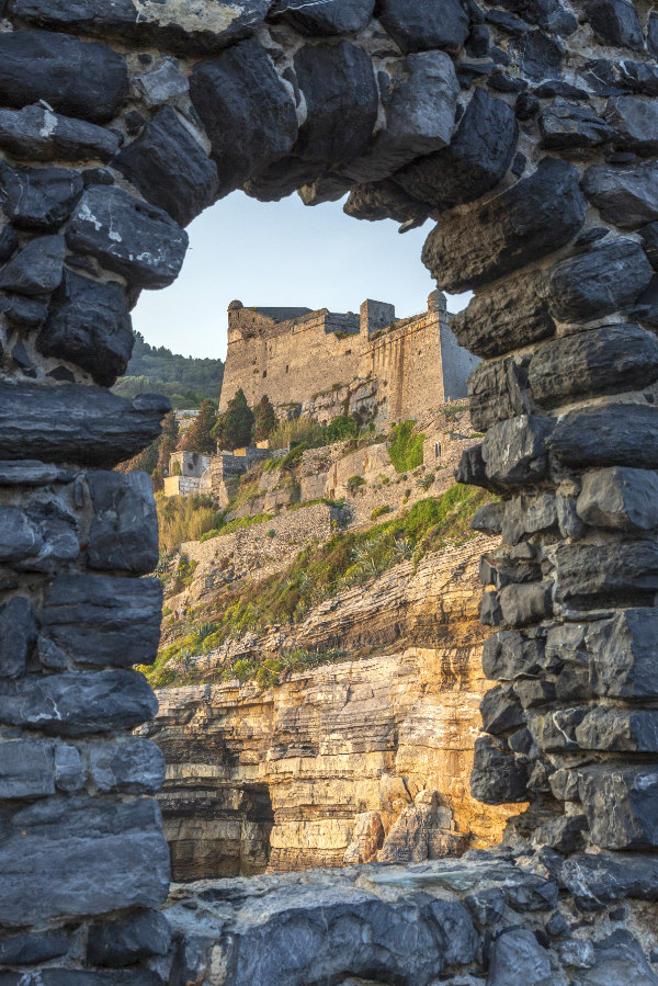 Porto Venere, Italy. View of Porto Venere castle trough a stone window. Poto Venere, Italy